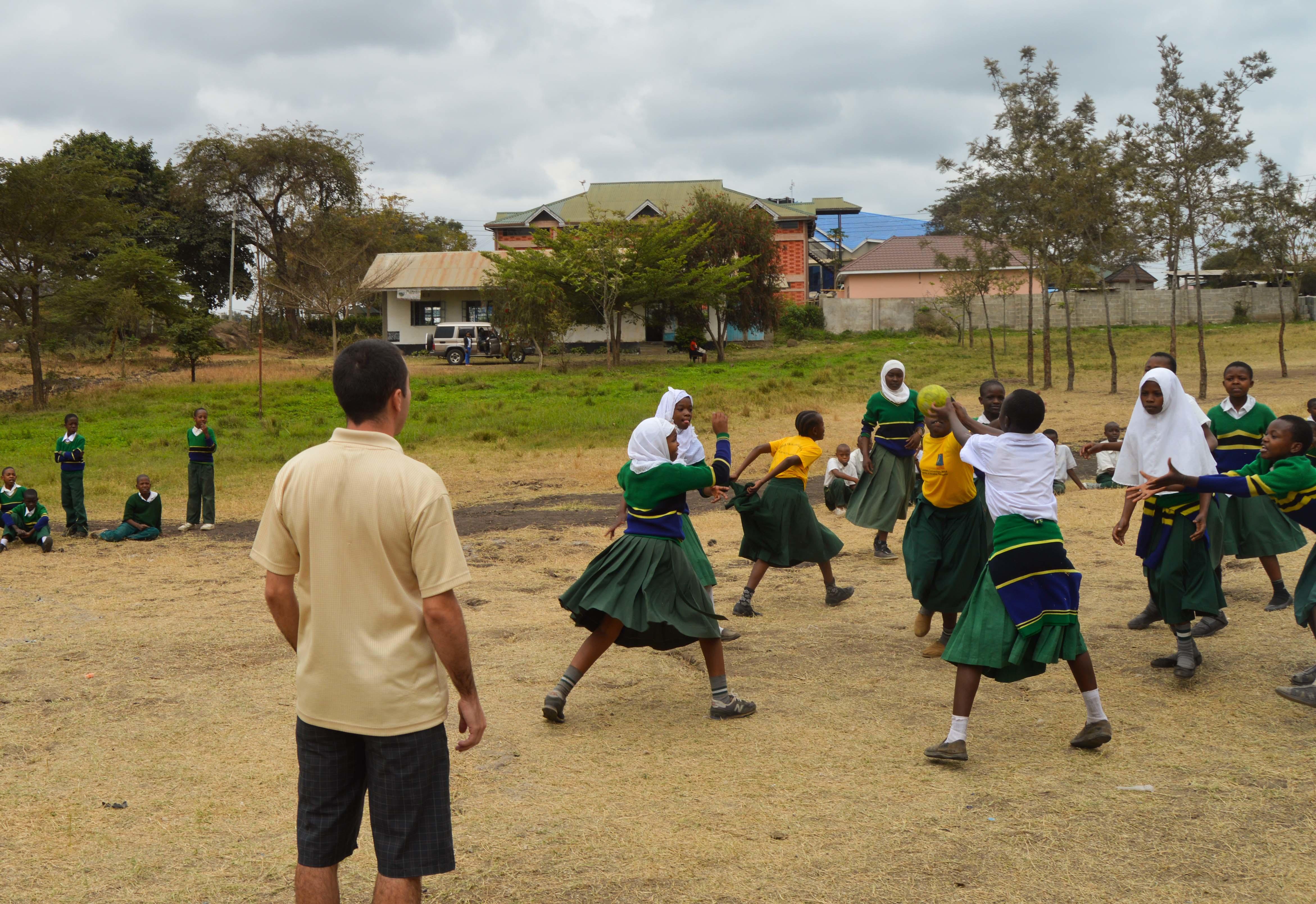 A physical education teacher volunteers as a sports coach in Tanzanian schools to improve students' sporting abilities A Projects Abroad volunteer coaches sports in schools in Tanzania